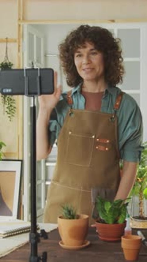 Woman Records Gardening Video on Phone at Home