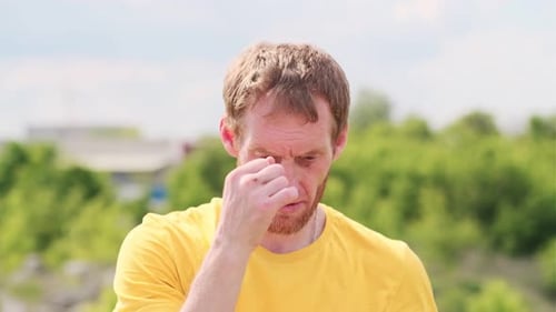 Man Practicing Boxing Moves in Scenic Park on a Sunny Afternoon