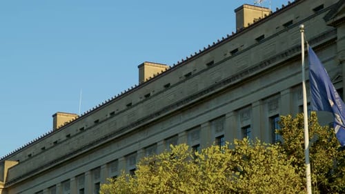 Department of Justice Building with American Flag Waving