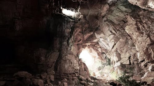 A Cave Filled with Lots of Rocks and Water