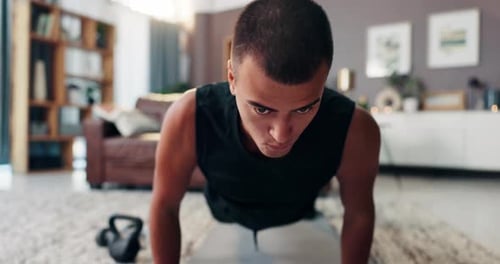 Young Man Doing Push-Ups at Home