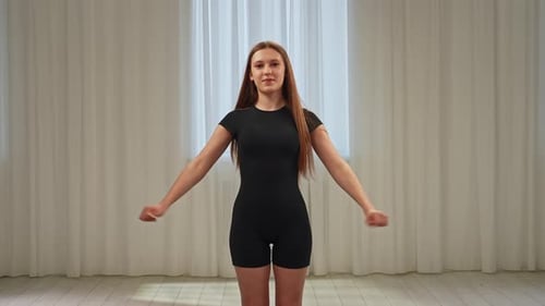 Young Teenager Girl Spending Time at Training Girl in Sportswear Attends Cheerleaders Training Class