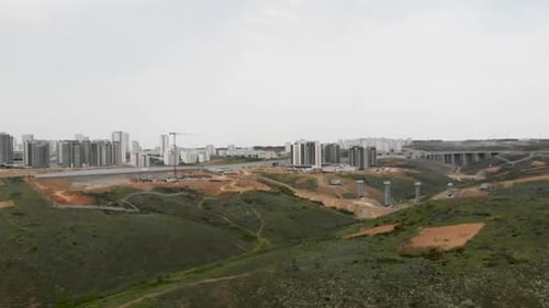 camera walking between the green hills heading for Construction Bridge Project view