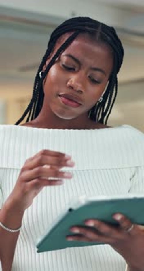Woman, scroll and reading in office with tablet for research, idea planning and project management