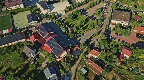 commercial building roofing lined with large solar panel arrays in Romania