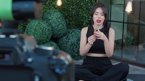 Woman Speaking in Front of a Camera