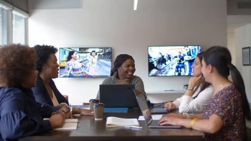 Businesswomen Planning at Laptops in Office Meeting 2529 Years