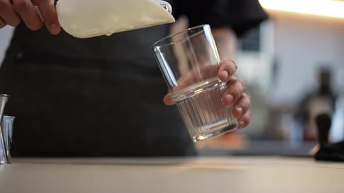 Ice Being Poured into Glass
