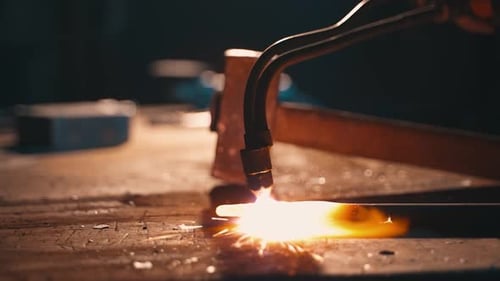 Closeup Oxygen Heating of Metal in a Workshop By a Production Worker