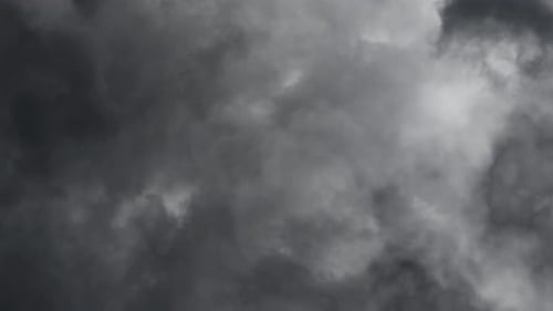 The discharge of lightning in the dark clouds as a background.