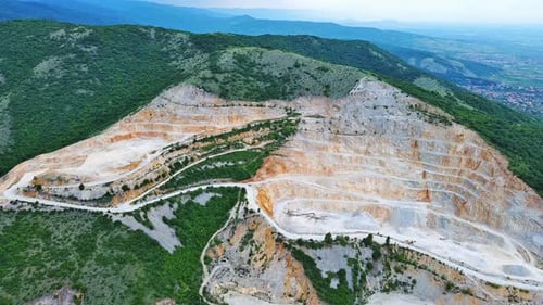 Natural Quarry is Located Near Road Against Backdrop of Rhodope Mountains and Hills with Forests and