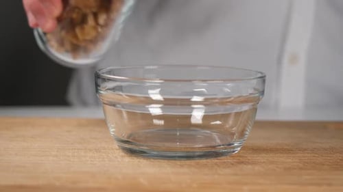 Walnuts Poured Into a Glass Bowl