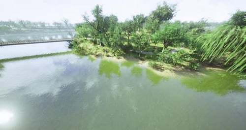 Lush Riverside Park with Greenery and Wooden Bridge on Sunny Day