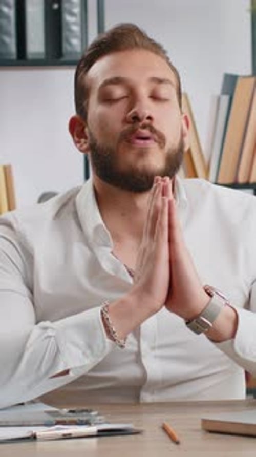 Businessman Working on Laptop Meditating Doing Yoga Breathing Exercise in Lotus Position at Office