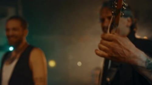Band Plays Live Music on Stage in Club