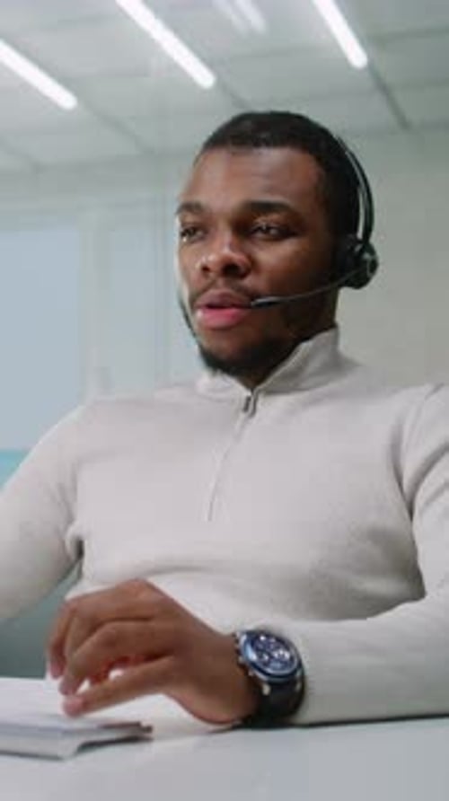 Young Man Working in Customer Service With Headset