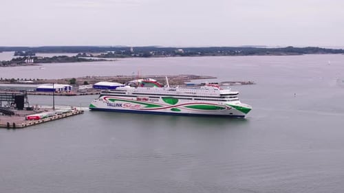 Aerial Footage of Large Cruise Ferry Boat Leaving Port and Transporting Passengers and Vehicles to