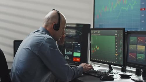Professional Man Working at Computer in Bright Office