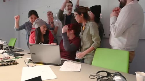 Excited Technology Team Celebrates Success in Modern Workplace