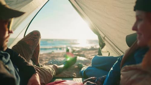 Tourism and Traveling in Summer Weekend People Lying in Tent and Admiring Sea Happiness and Joy in