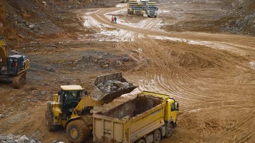 Excavator Loads Stone