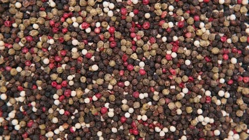 Variety of Colorful Peppercorns Overhead Shot Zoom