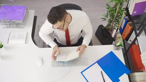 Businessman working in his office, time lapse.