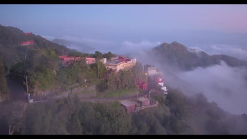 Aerial View of Mountain Village in the Clouds