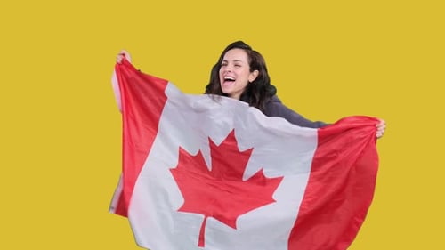 Woman Waving Canadian Flag Enthusiastically