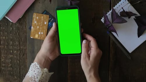 Online Payments Mobile App Mockup Hands Scrolling Green Screen on Smartphone