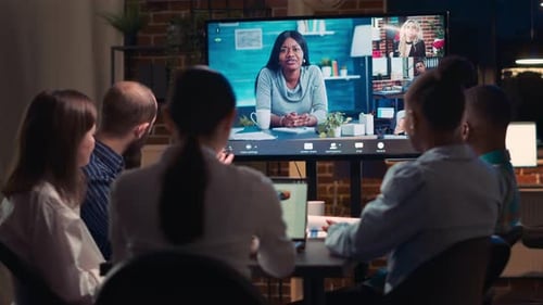 Team Meeting on Video Conference in Modern Office