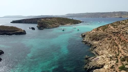 Drone view of Blue Lagoon, Comino island, Malta, Europe. Turquoise water and blue shades in the Medi