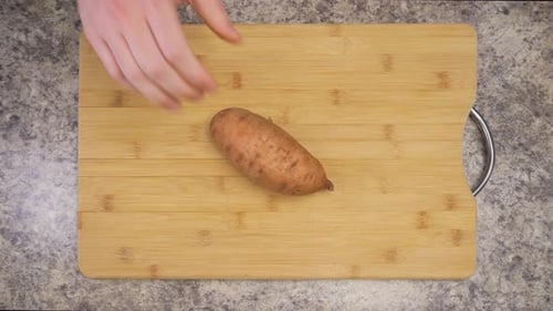 Sweet Potato on Cutting Board, Ready to Cook