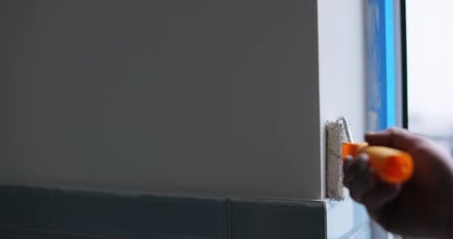 Hand Painting Wall with Roller at Home