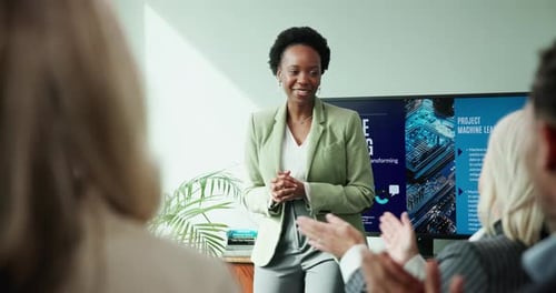 Applause, meeting and presentation with business woman in boardroom for machine learning workshop