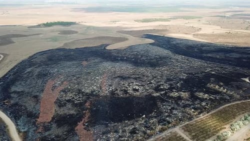 Aerial footage over Burnt hills in the desert