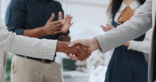 Handshake, applause and group in office with celebration, promotion and congratulations