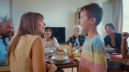 Family Gathered Around Table Sharing Meal Together