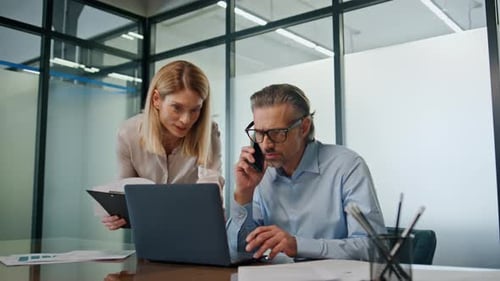 Smiling Businesspeople Collaborating in Modern Office