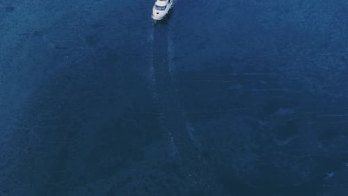 Yachting On Frozen Water During Winter In Tacoma, Washington, USA. aerial static shot