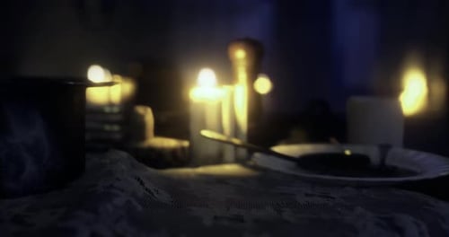 Flickering Candles on Lace Table with Warm Bokeh Light