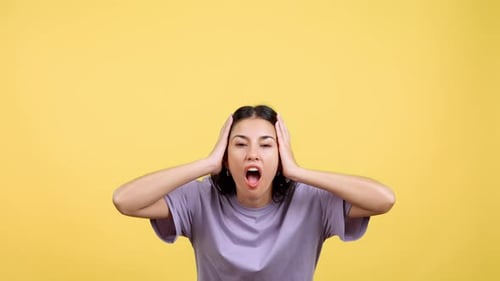 Shocked Woman with Hands on Her Head