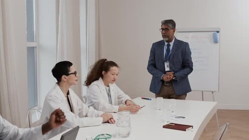 Doctors in Meeting Discussing Clinical Topics at Office