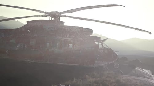 Old Rusted Military Helicopter in the Desert at Sunset