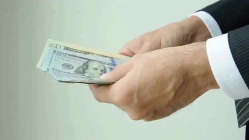 counting money, dollar money. counting cash