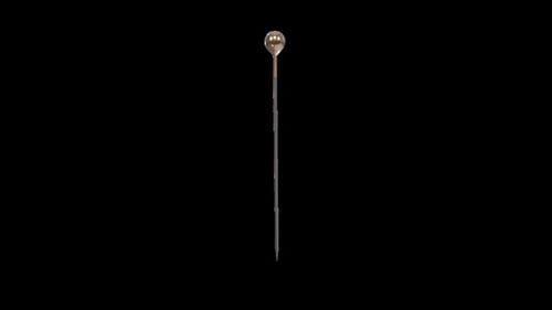 Close-Up of a Metallic Pin on Black Background