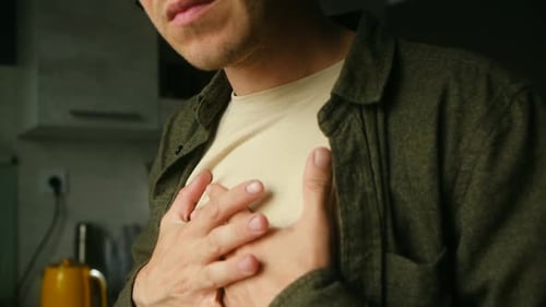Adult Experiencing Chest Pain at Home