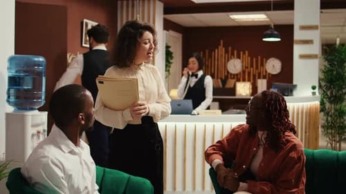 Hotel Manager Taking Tourist Feedback