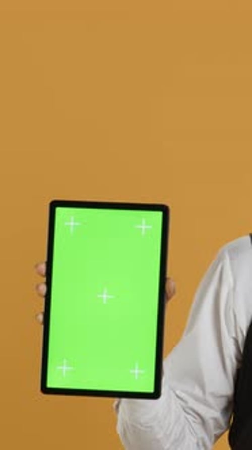 Vertical Video Waiter Showing a Tablet with Isolated Copy Space in Studio