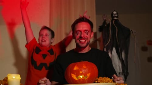 Spooky Man and Boy Celebrate Halloween at Home